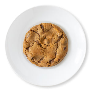 An overhead view of a Harvest Spice Chocolate Chip Cookie, showcasing its golden-brown surface speckled with rich chocolate chips