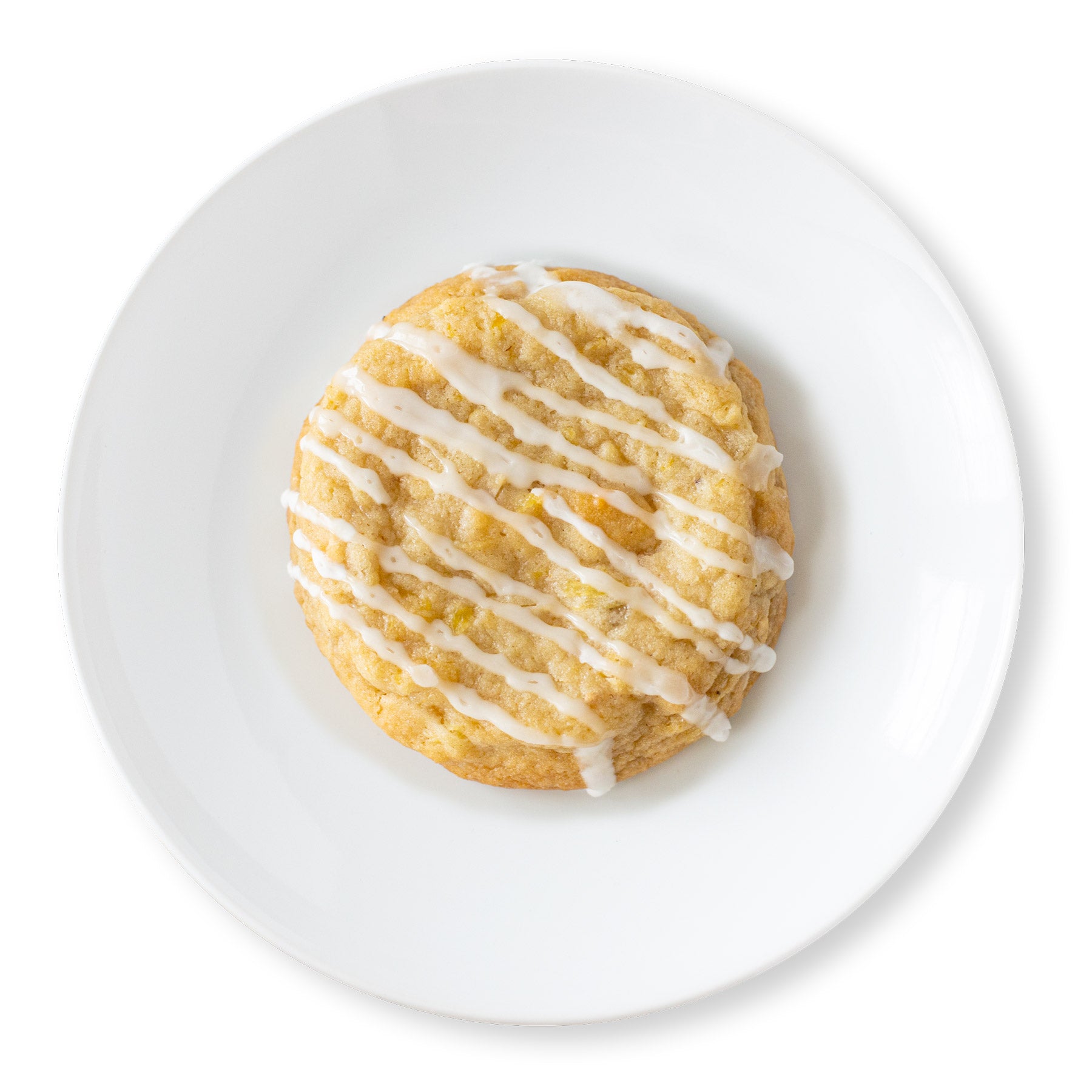 Pineapple coconut cookie with toasted coconut and pineapple chunks, topped with pineapple glaze.